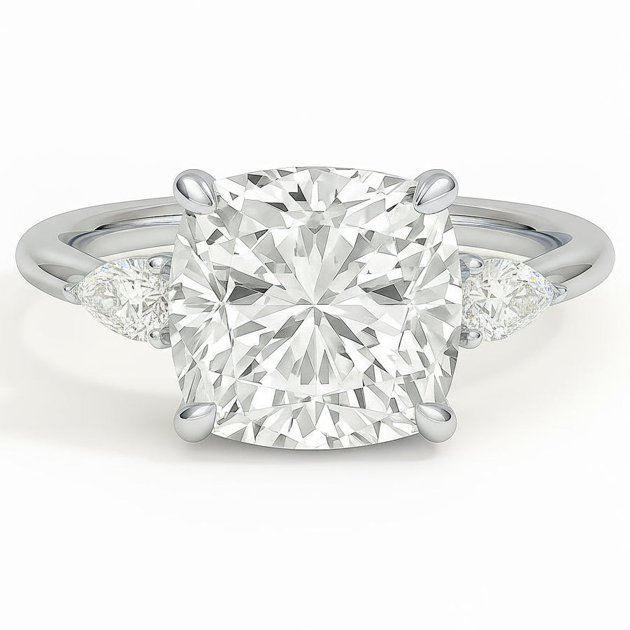 Cushion cut diamond white gold three-stone pear engagement ring front view