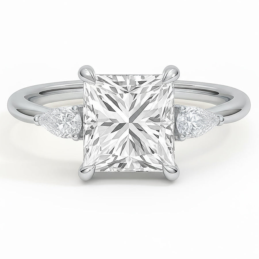 Princess cut diamond white gold three-stone pear engagement ring front view
