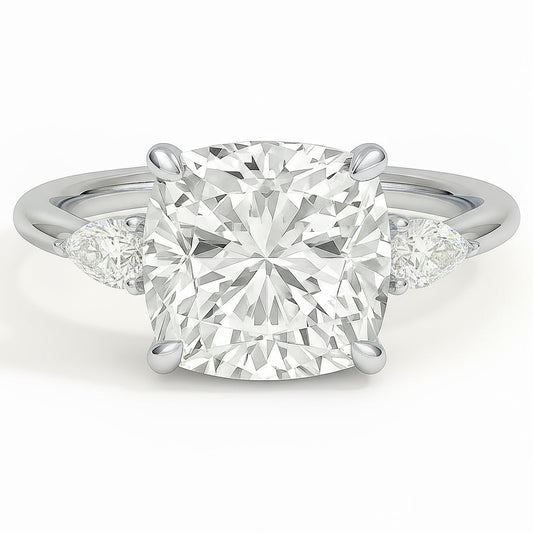 Cushion cut diamond white gold three-stone pear engagement ring front view