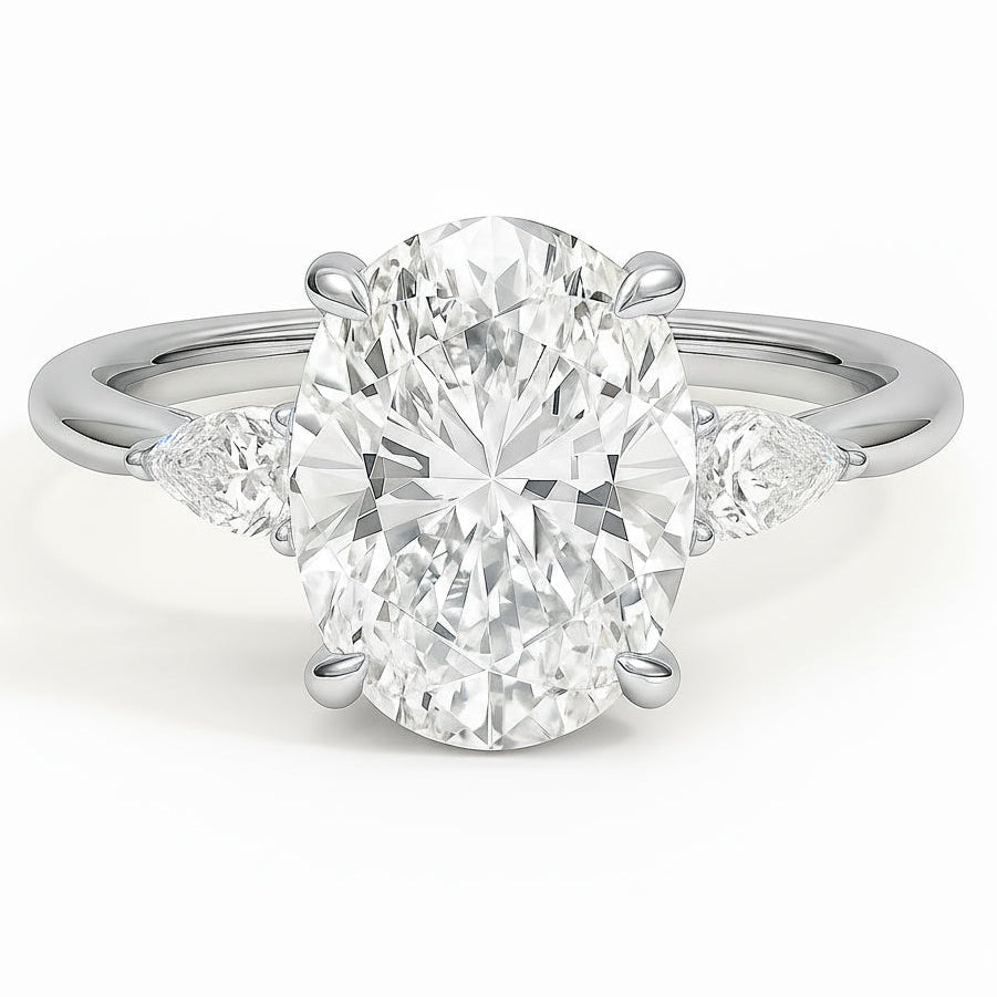 Oval cut diamond white gold three-stone pear engagement ring front view