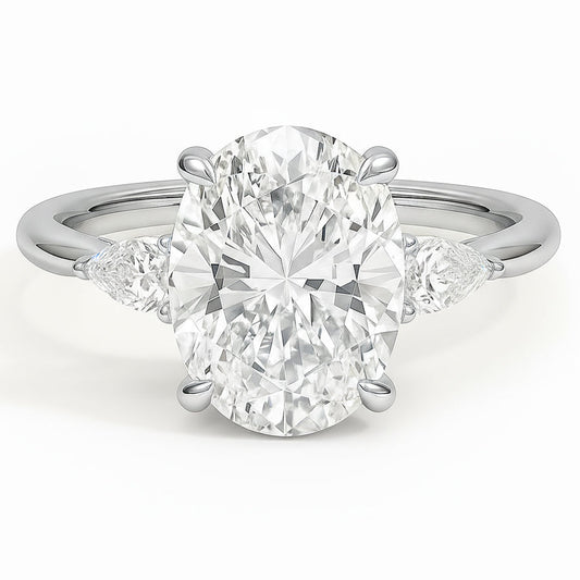 Oval cut diamond white gold three-stone pear engagement ring front view