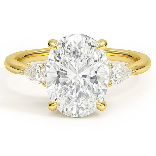 Oval cut diamond yellow gold three-stone pear engagement ring front view