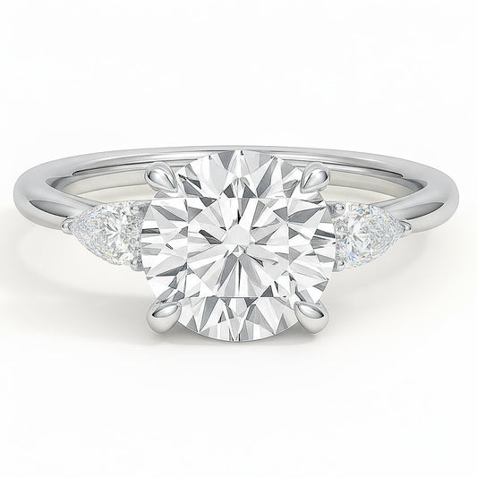 Round cut diamond white gold three-stone pear engagement ring front view