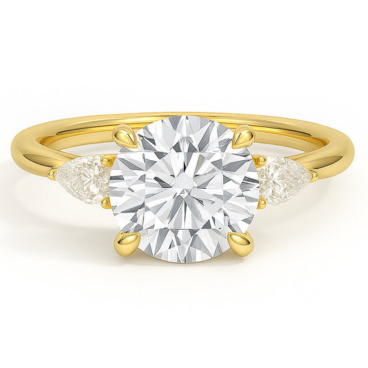 Round cut diamond yellow gold three-stone pear engagement ring front view